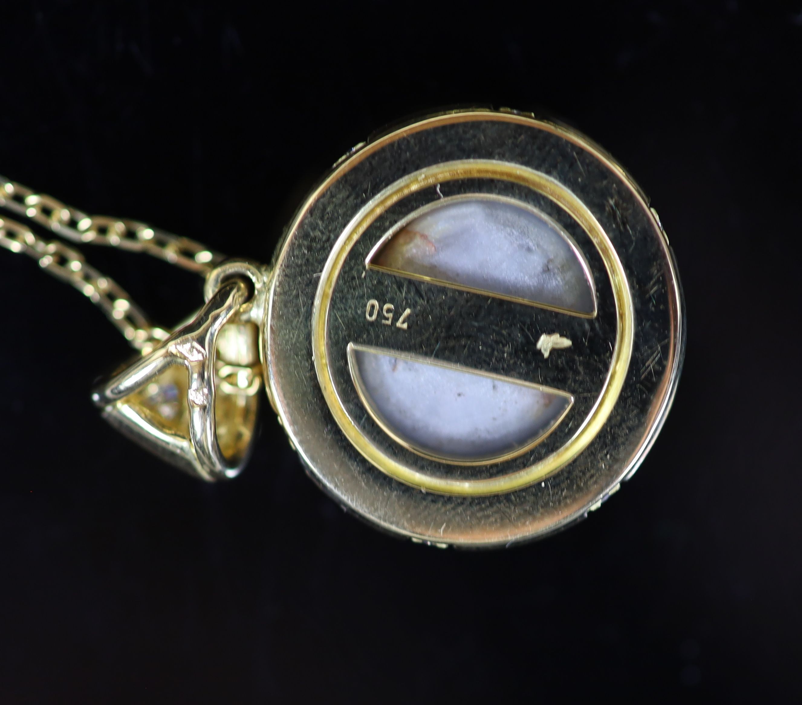 A 20th century French 18ct gold, cabochon star sapphire and diamond set circular pendant, on an 18ct gold fine link chain